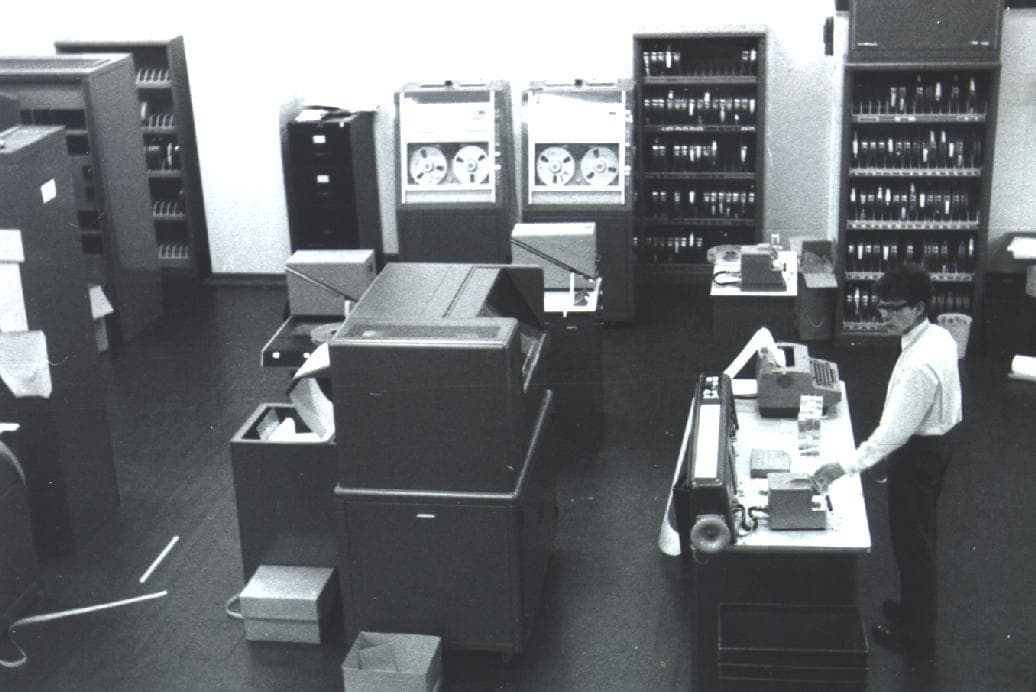 The Titan computer at the University of Cambridge: tape drives, card files, and an operator at a console.